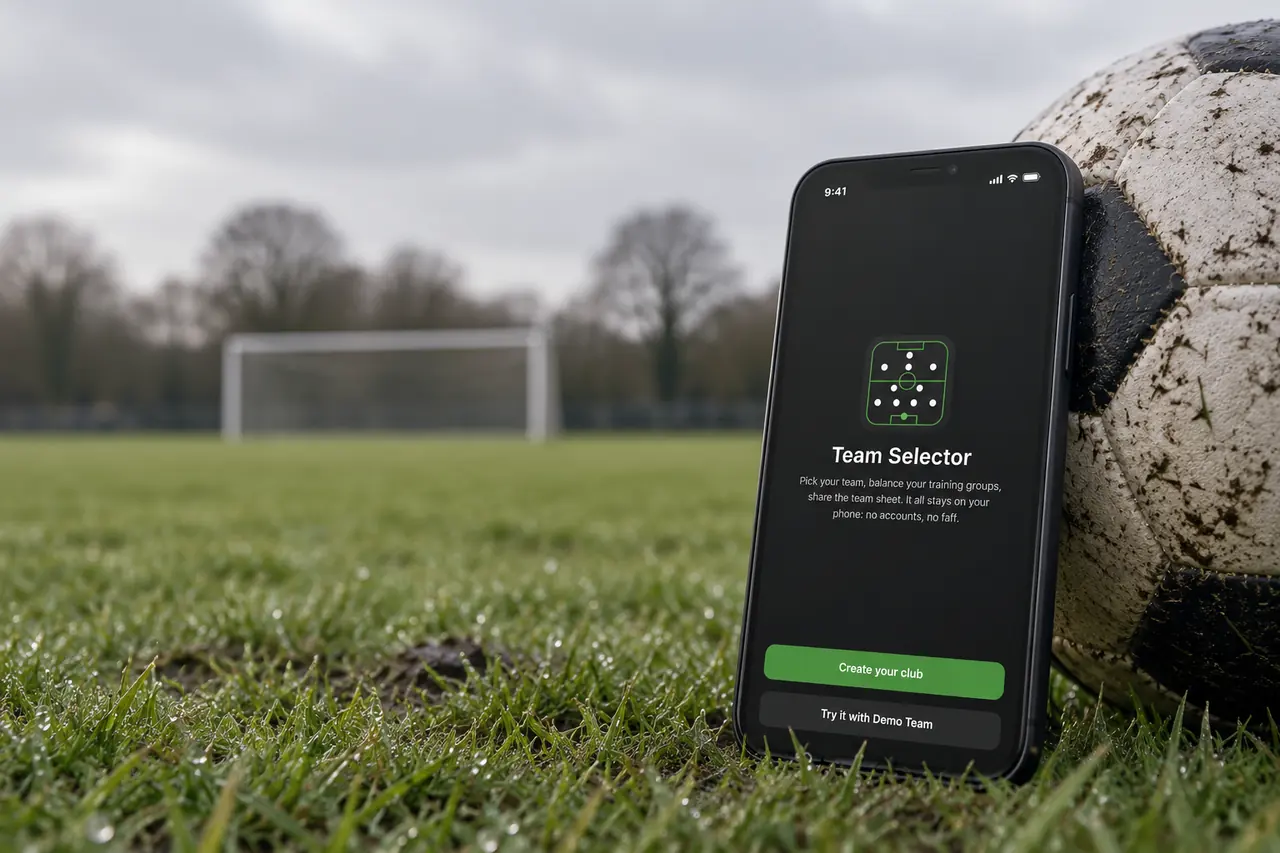 Phone showing the Team Selector welcome screen, standing on a pitch beside a football